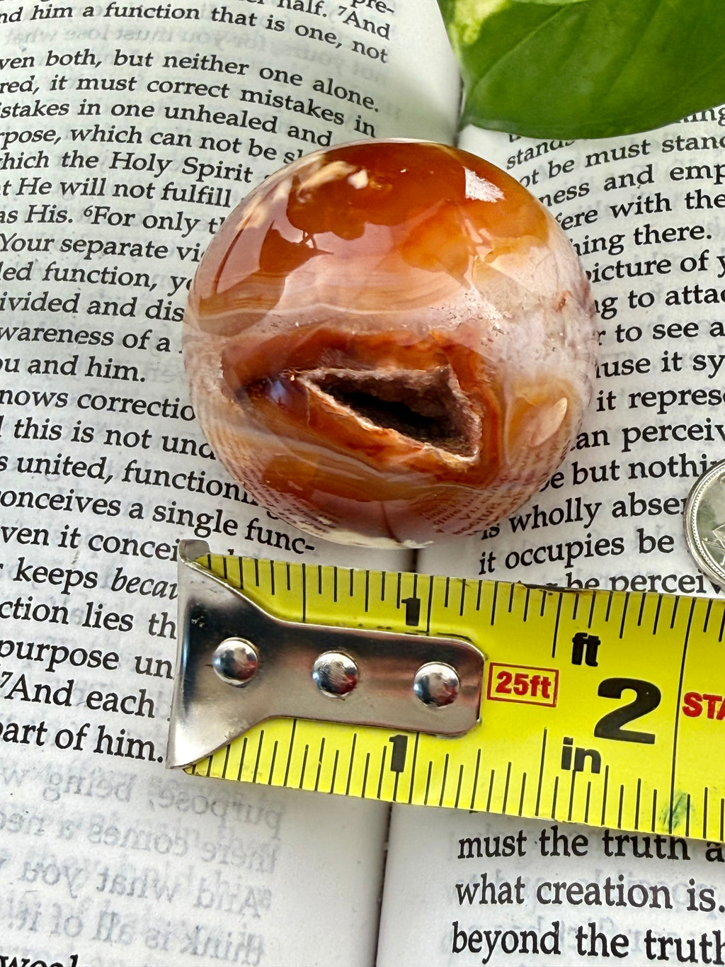 Carnelian Sphere with measuring tape showing it to be about 1.5"