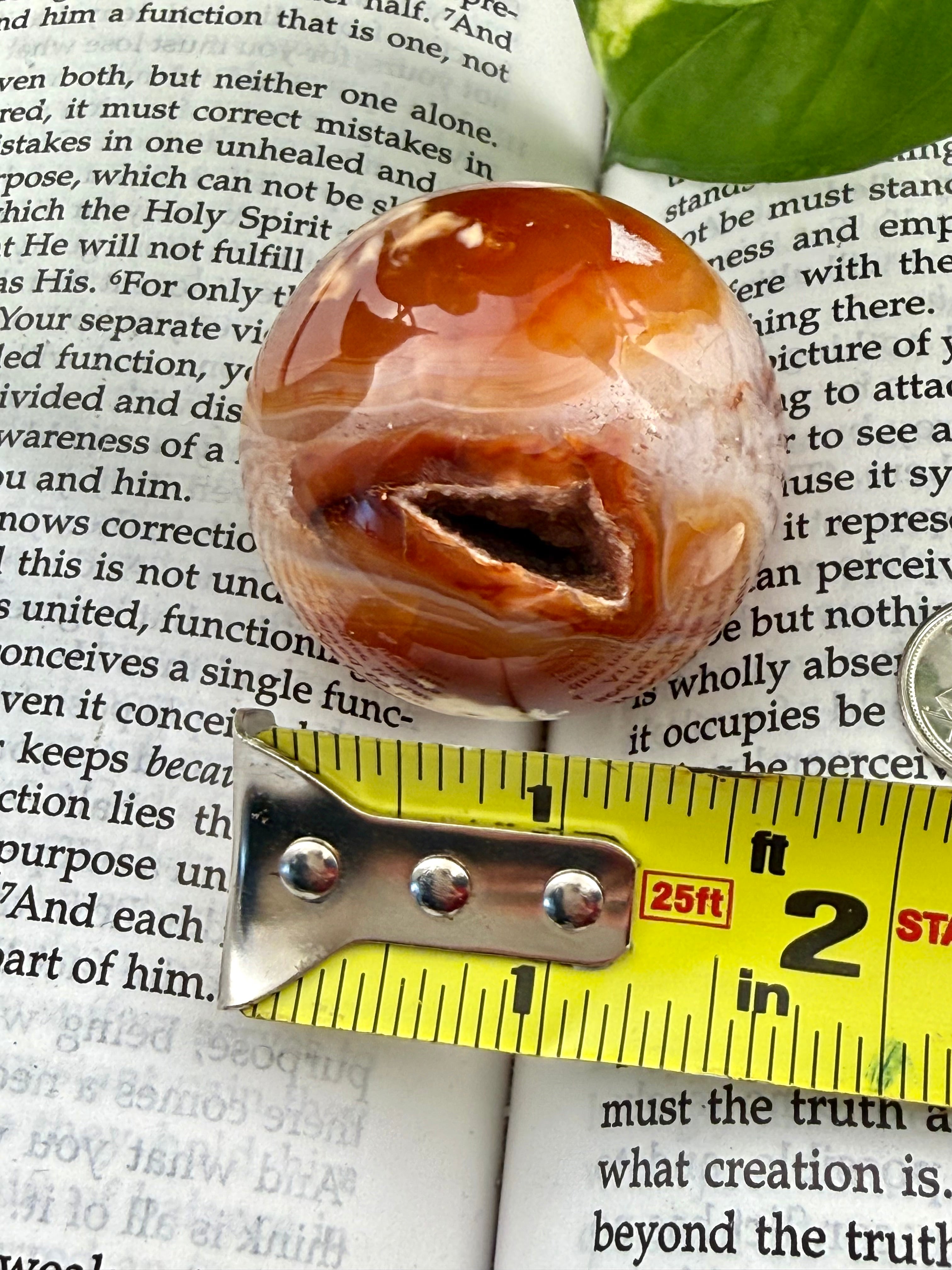 Carnelian Sphere with measuring tape showing it to be about 1.5"