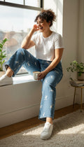 100% Cotton Playboy Bunny Print Wide Leg Jeans | Size 13 at Blue Sparrow Shop on woman sitting in window seat