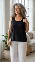 100% Cotton Relaxed Fit Vintage Tank | Size M at Blue Sparrow Shop on woman standing by window