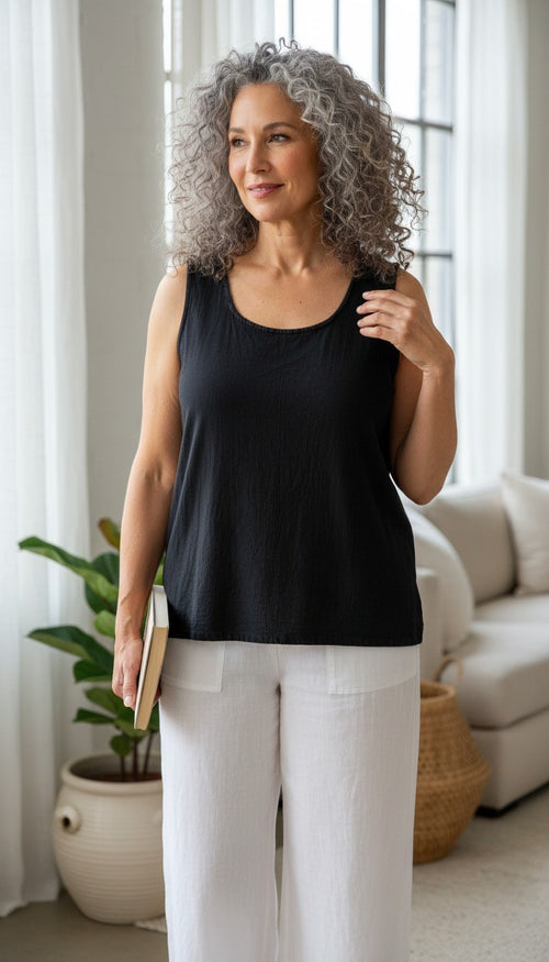 100% Cotton Relaxed Fit Vintage Tank | Size M at Blue Sparrow Shop on woman standing by window