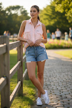 100% Cotton Royal Robbins Sleeveless Top | Size M at Blue Sparrow Shop on woman standing by rail fence wearing jean shorts