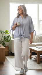 100% cotton simple striped batwing button front shirt with tie at waist at Blue Sparrow Shop resale Canada on woman in white linen pants