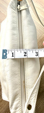 80's style retro leather bag - made in Canada measuring about 3" when full 