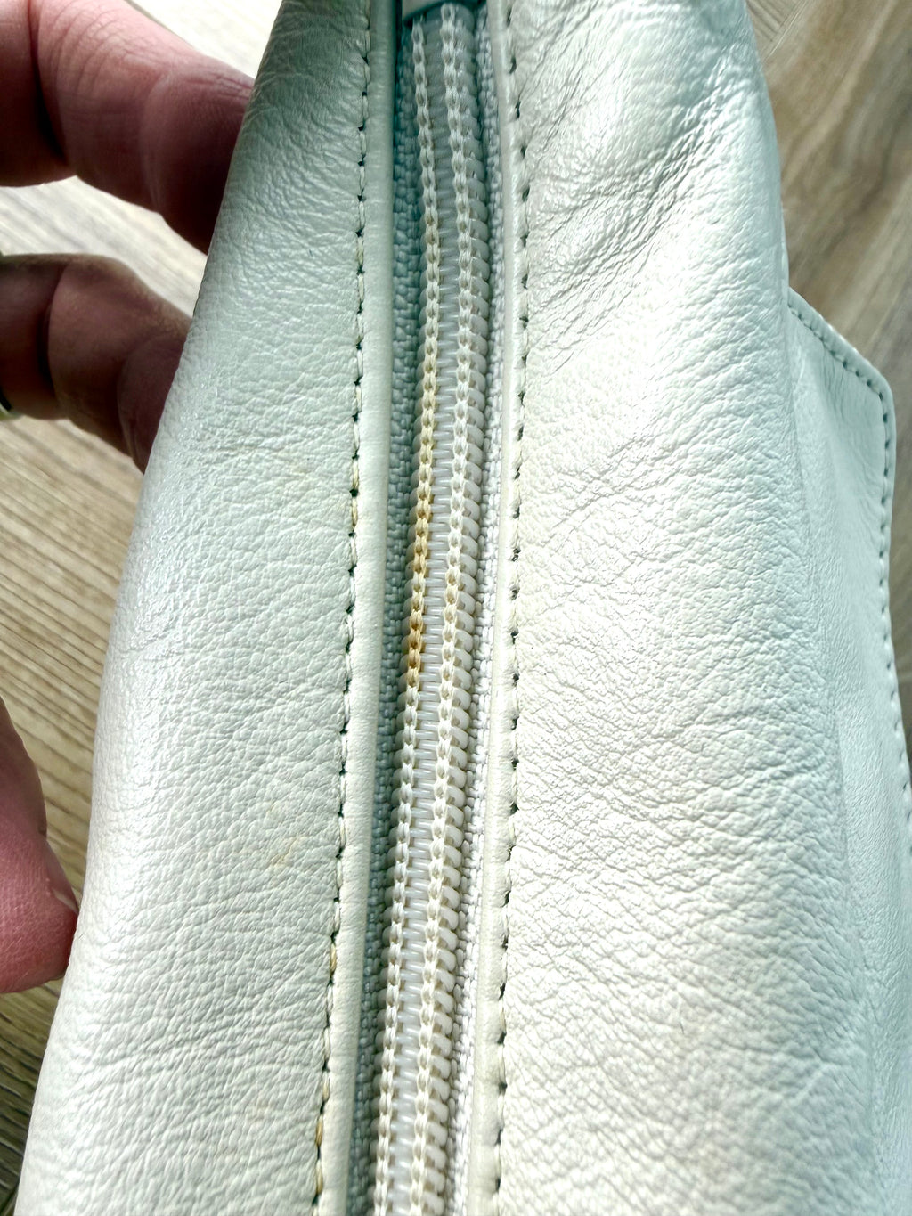 80's style retro leather bag - made in Canada measuring about 3" when full  mark on top zipper