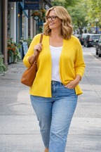 89th and Madison bright yellow cropped cardigan at Blue Sparrow Shop on woman walking outside 