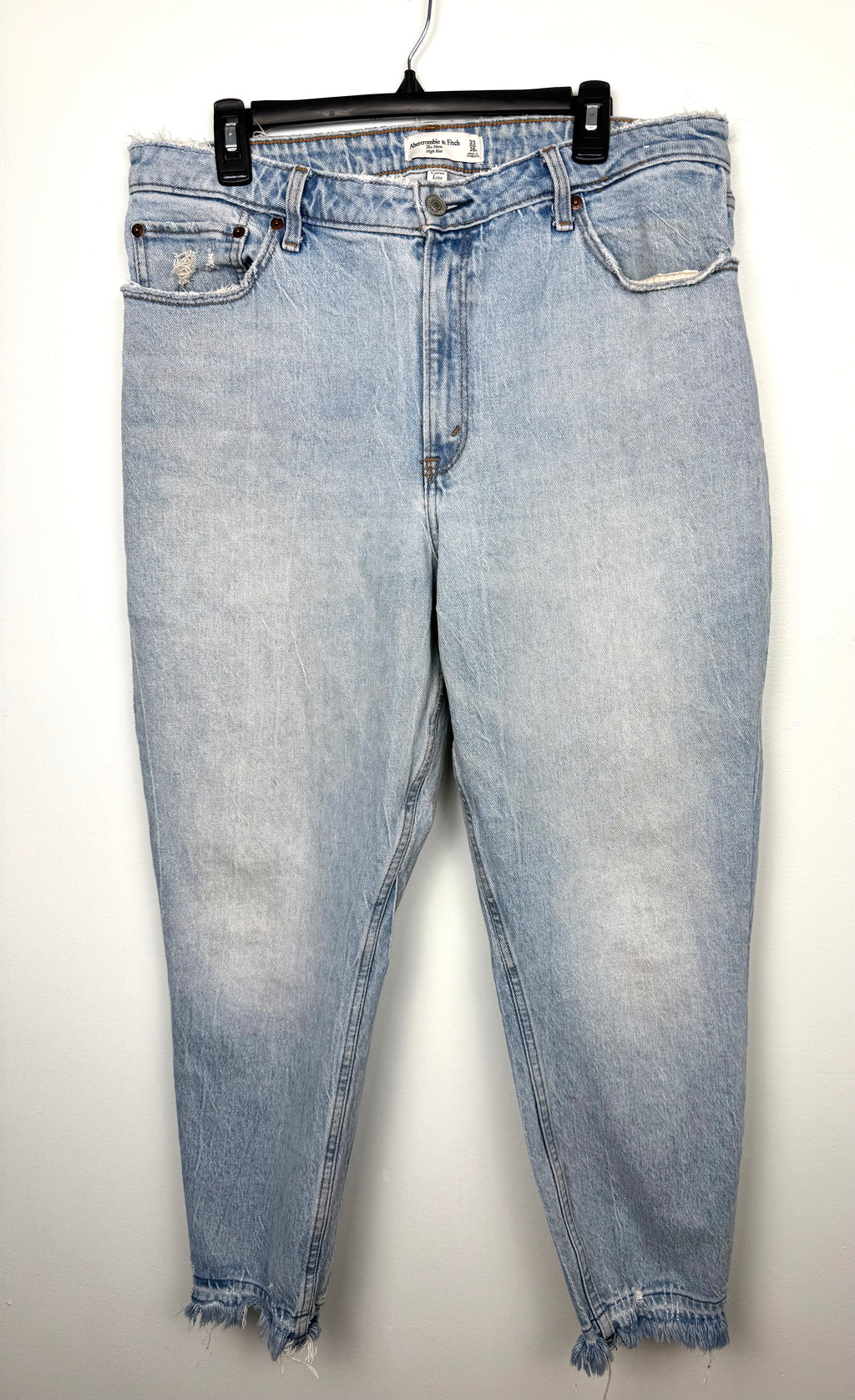 Abercrombie & Fitch Curve Love high rise mom jeans light wash distressed denim front view on hanger