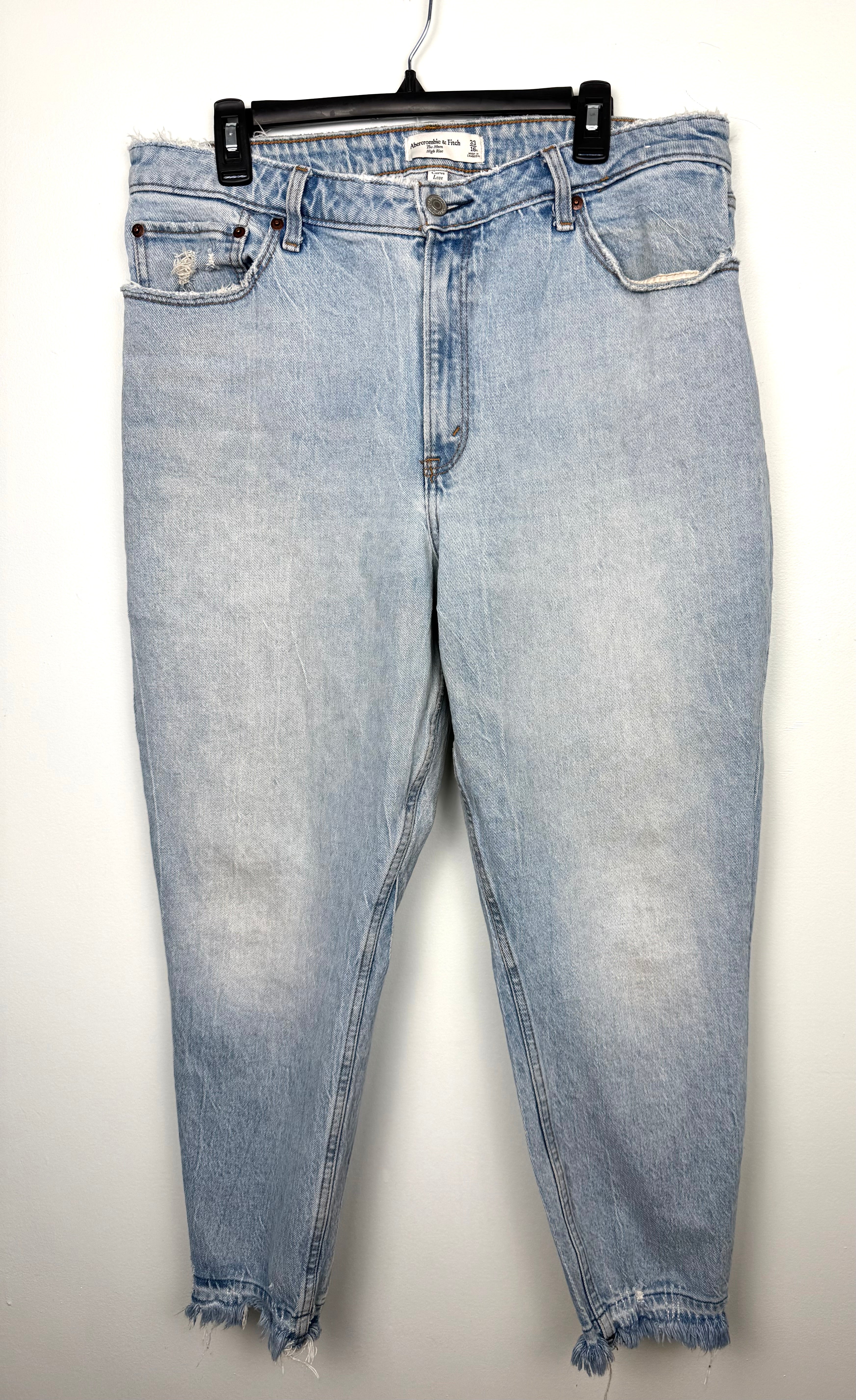 Abercrombie & Fitch Curve Love high rise mom jeans light wash distressed denim front view on hanger