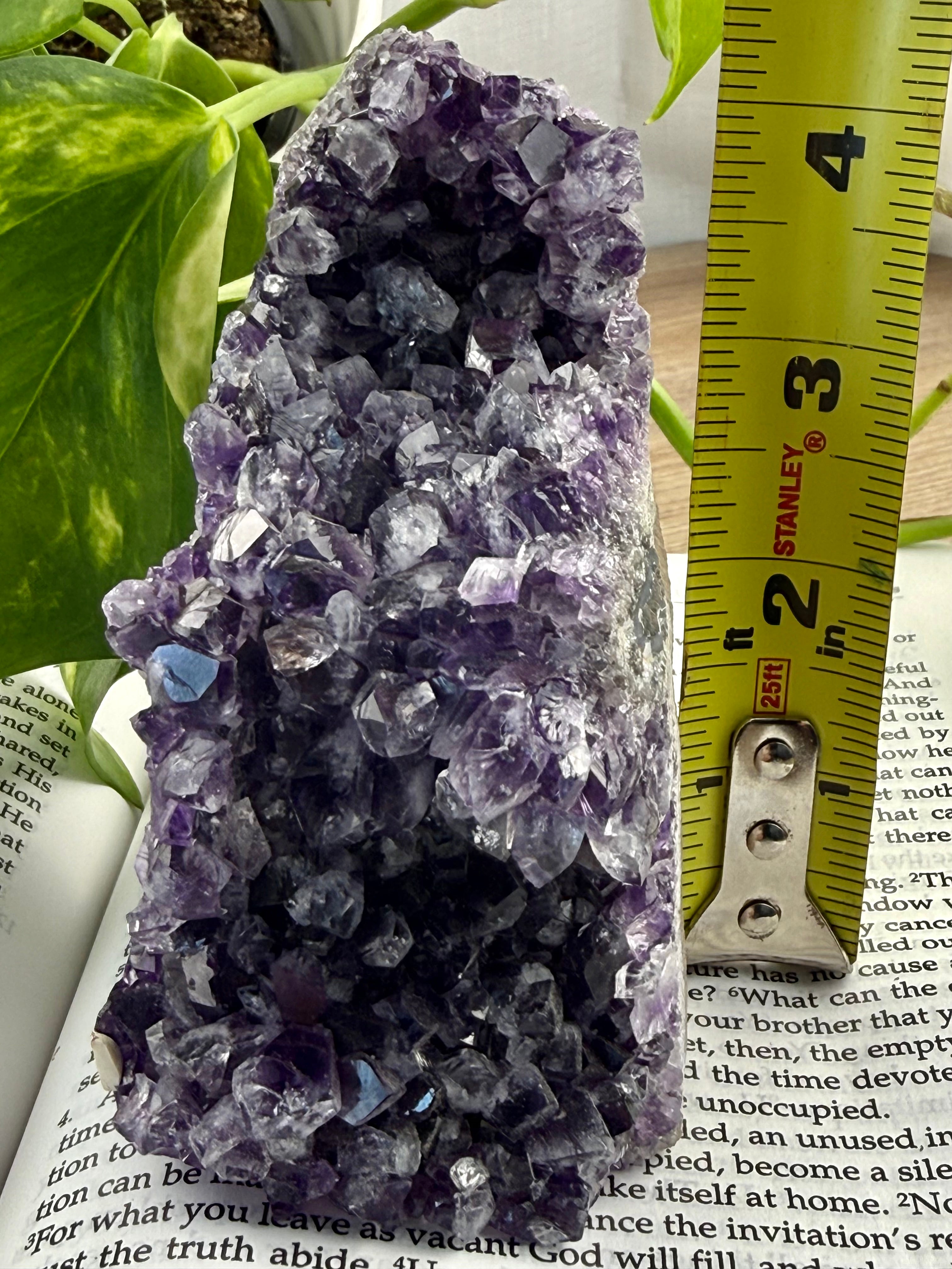 Amethyst Cathedral with measuring tape showing it 4 inches high

