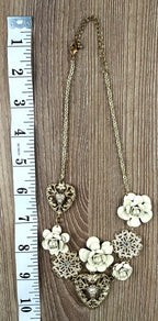 Antique gold-tone filigree heart and ivory enamel rose cluster statement necklace at Blue Sparrow Shop measuring approx 20" long when extended