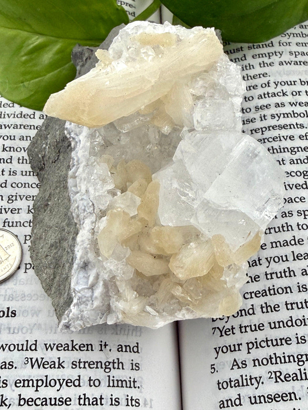 up close of apophyllite stilbite on a book