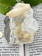 up close of apophyllite stilbite on a book