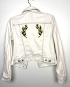 Aritzia Talula Distressed cropped denim jacket with leaf emblem on back 