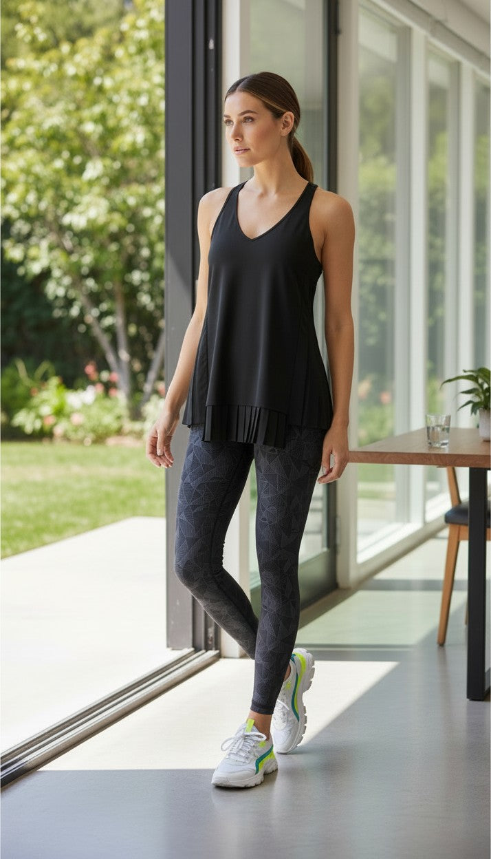Athleta Black Pleated Flowy Tank Top at Blue Sparrow Shop on woman looking out patio door