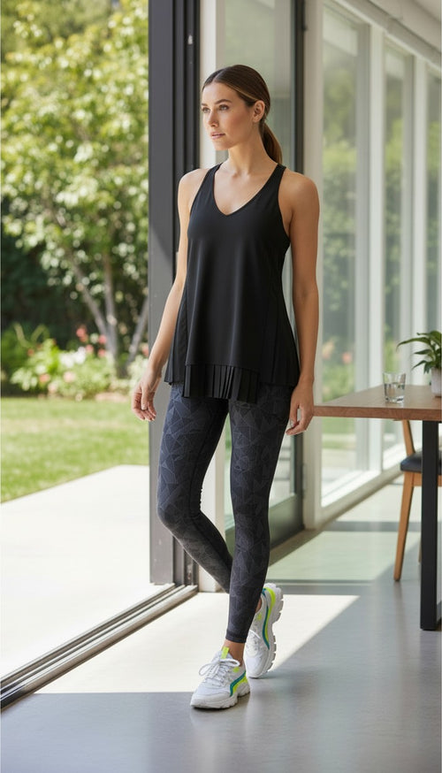 Athleta Black Pleated Flowy Tank Top at Blue Sparrow Shop on woman looking out patio door