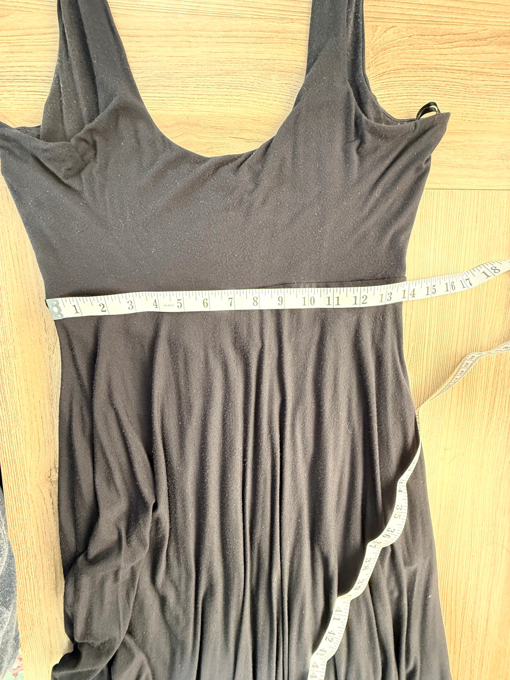 Athleta black dress showing measurement of 28 inch waist 