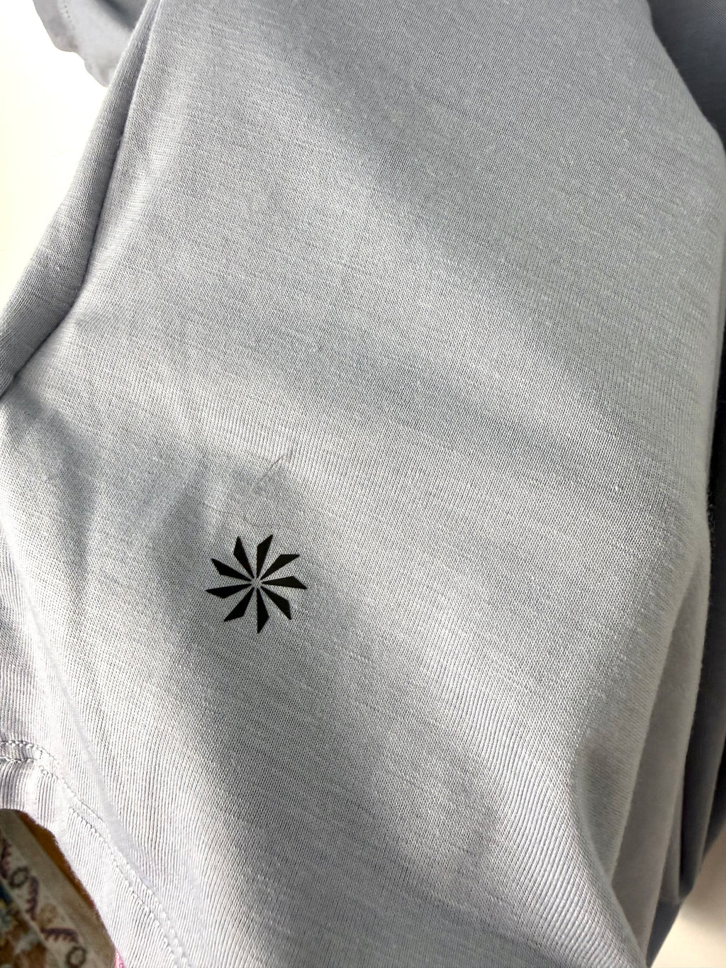 Athleta logo on back of Grey Athleta Vital Tank 2.0 sleeveless top, lightweight performance fabric, minimalist athletic layering piece