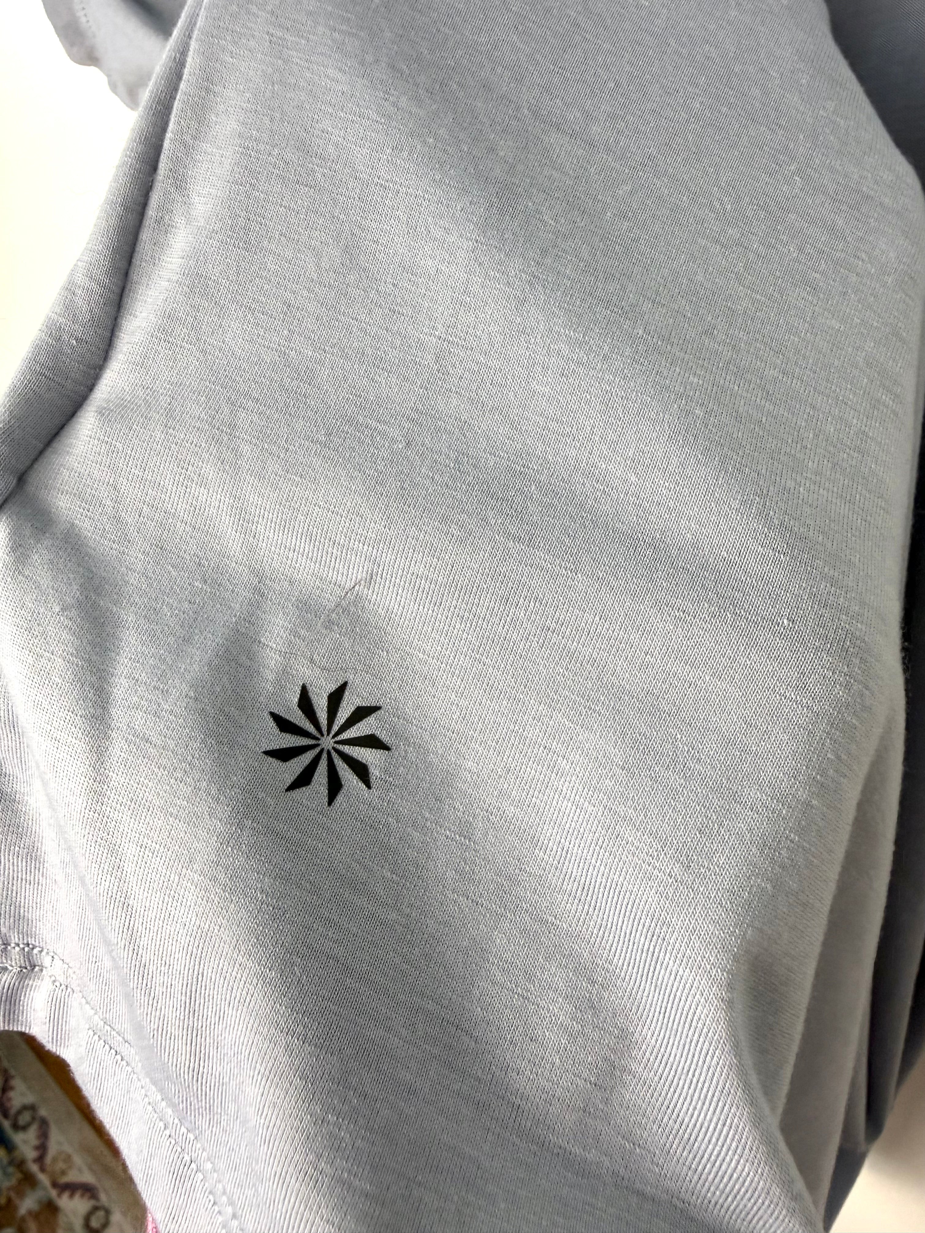 Athleta logo on back of Grey Athleta Vital Tank 2.0 sleeveless top, lightweight performance fabric, minimalist athletic layering piece