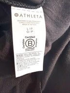 Close-up of Athleta interior fabric content tag showing modal and spandex blend and Certified B Corporation label.