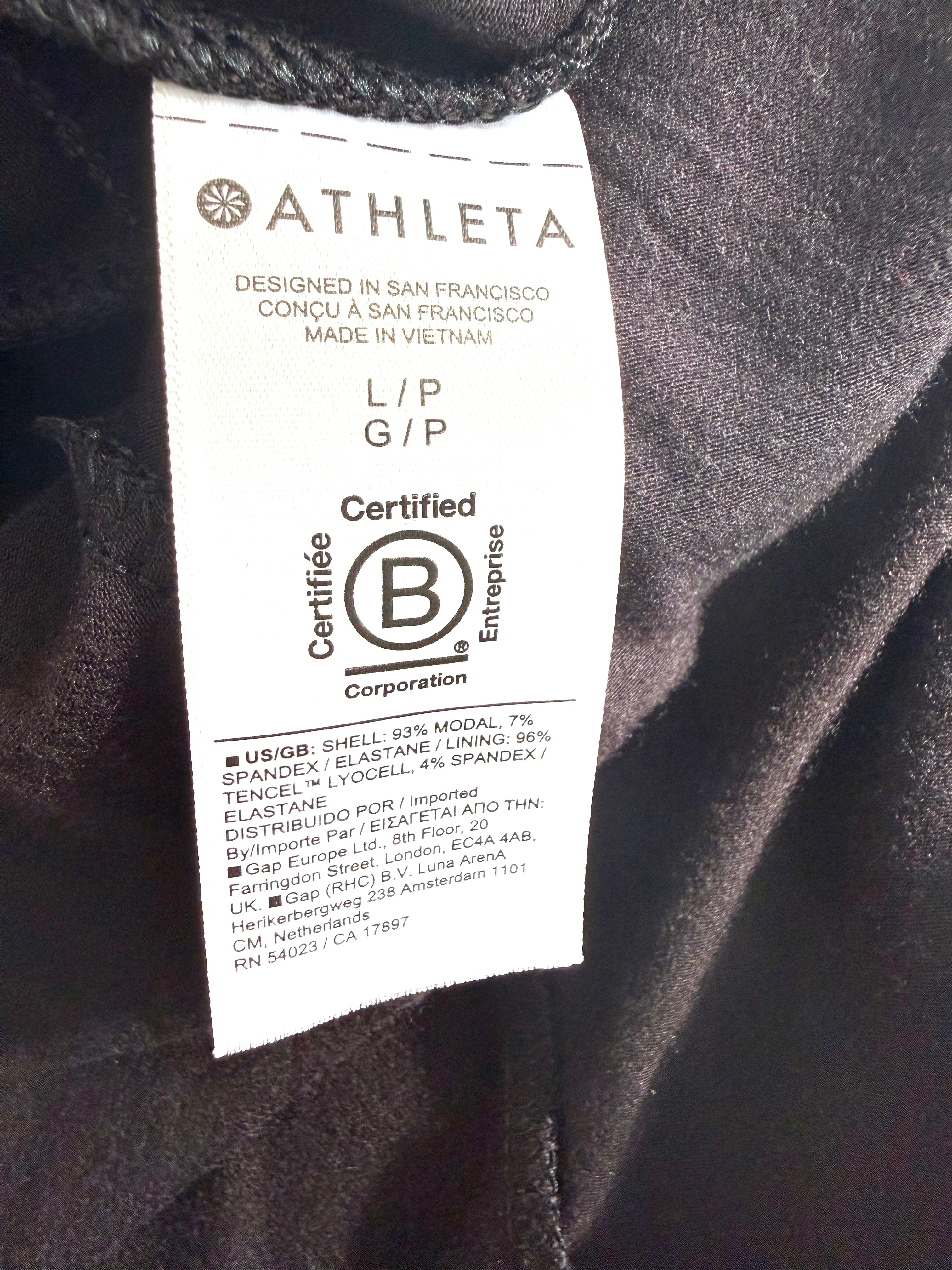 Close-up of Athleta interior fabric content tag showing modal and spandex blend and Certified B Corporation label.
