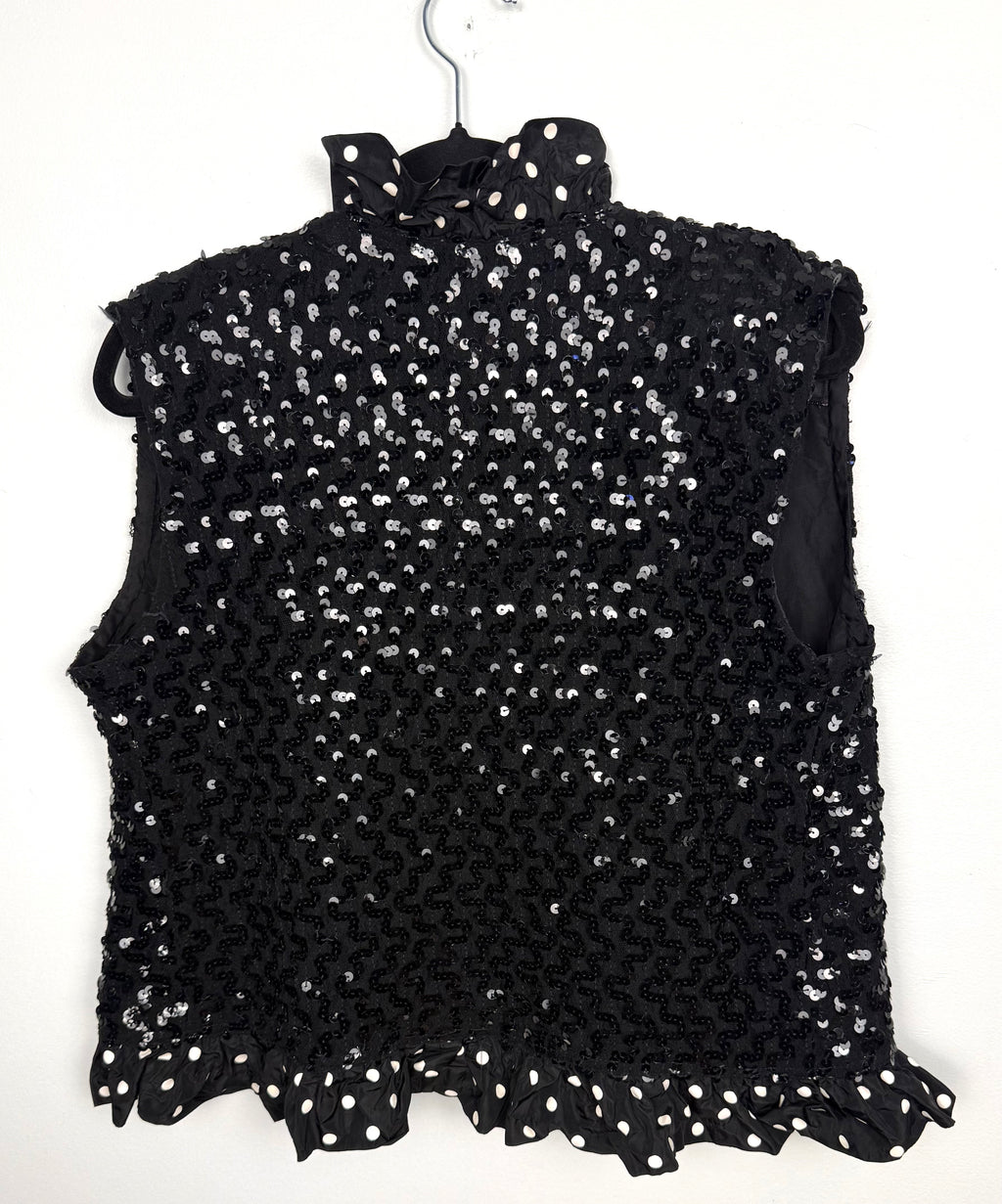 Back of black sequin sleeveless statement vest