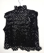 Back of black sequin sleeveless statement vest
