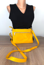 Back view of Enzo Bertini yellow leather crossbody purse with exterior zip pocket