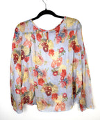 Back view of Kensie blue floral long sleeve blouse with button closure