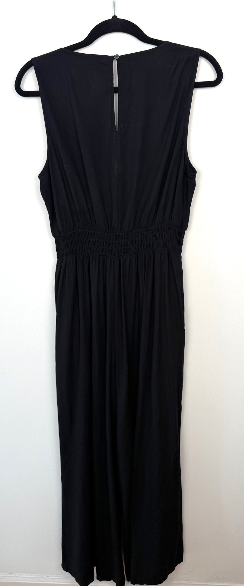 Back view of GAP black wide leg jumpsuit with keyhole button closure size large