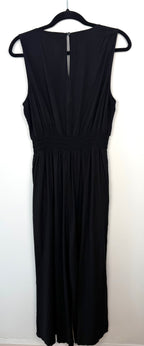 Back view of GAP black wide leg jumpsuit with keyhole button closure size large