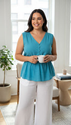 Banana Republic 100% Linen Smocked Waist V-Neck Blouse Aqua Coloured | Size L at Blue Sparrow Shop Canadian Resale Reimagined  on woman drinking coffee
