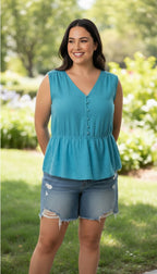Banana Republic 100% Linen Smocked Waist V-Neck Blouse Aqua Coloured | Size L at Blue Sparrow Shop Canadian Resale Reimagined  on woman outside 