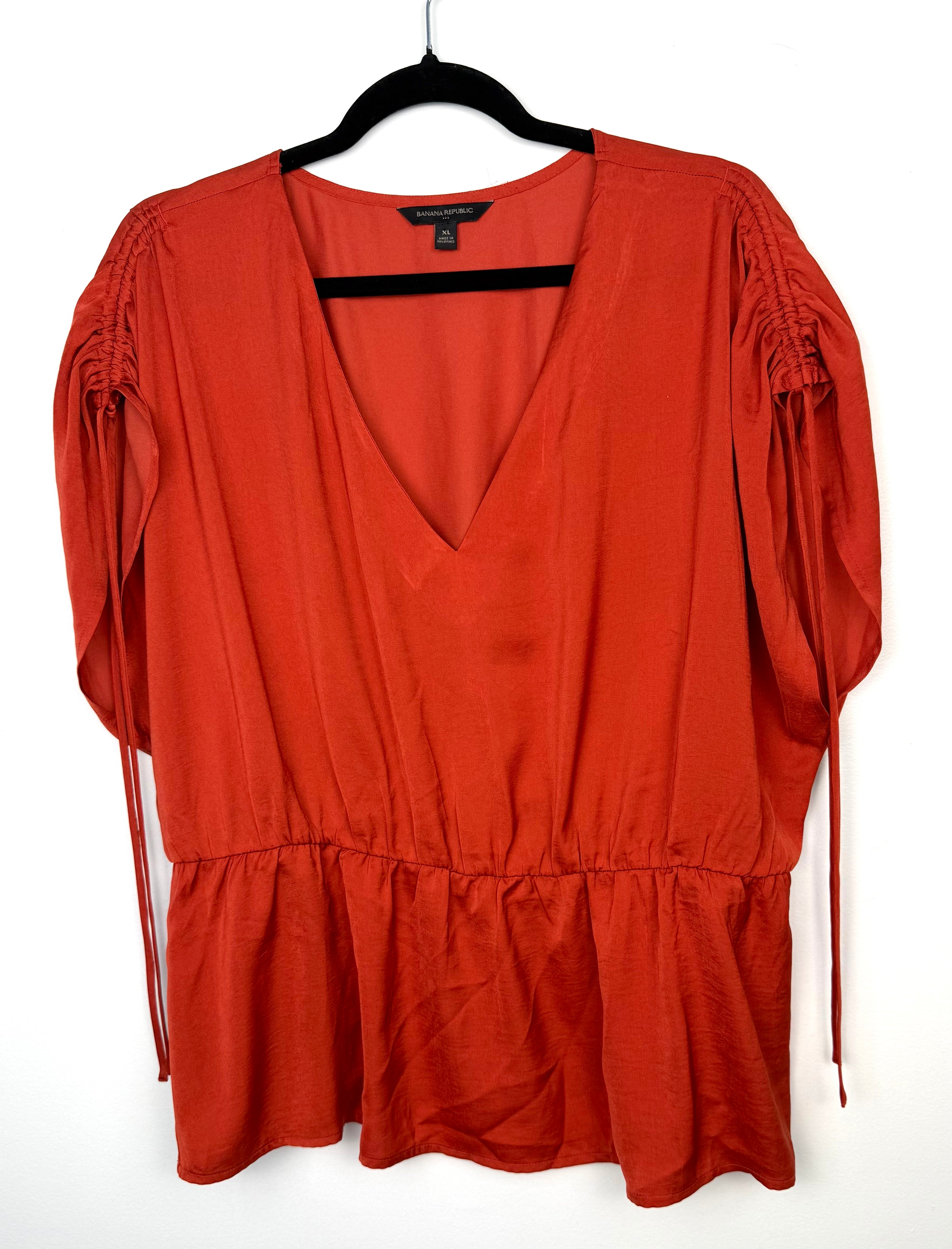 Banana Republic ruched sleeve peplum top in rust  on hanger