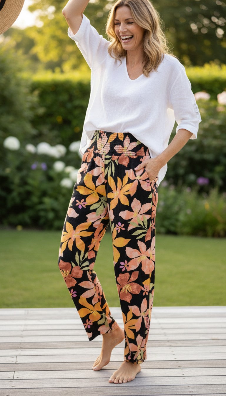 Billabong Wide Leg Pants with Smocked Waist at Blue Sparrow Shop on woman having fun outside 
