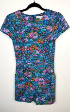 front of Birds of North America floral romper with impressionist hydrangea print on hanger