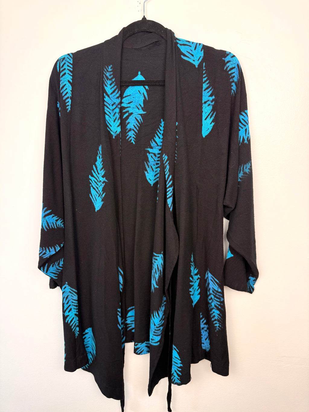 Black & Turquoise Feather Print One-Size Wrap Kimono Jacket on hanger