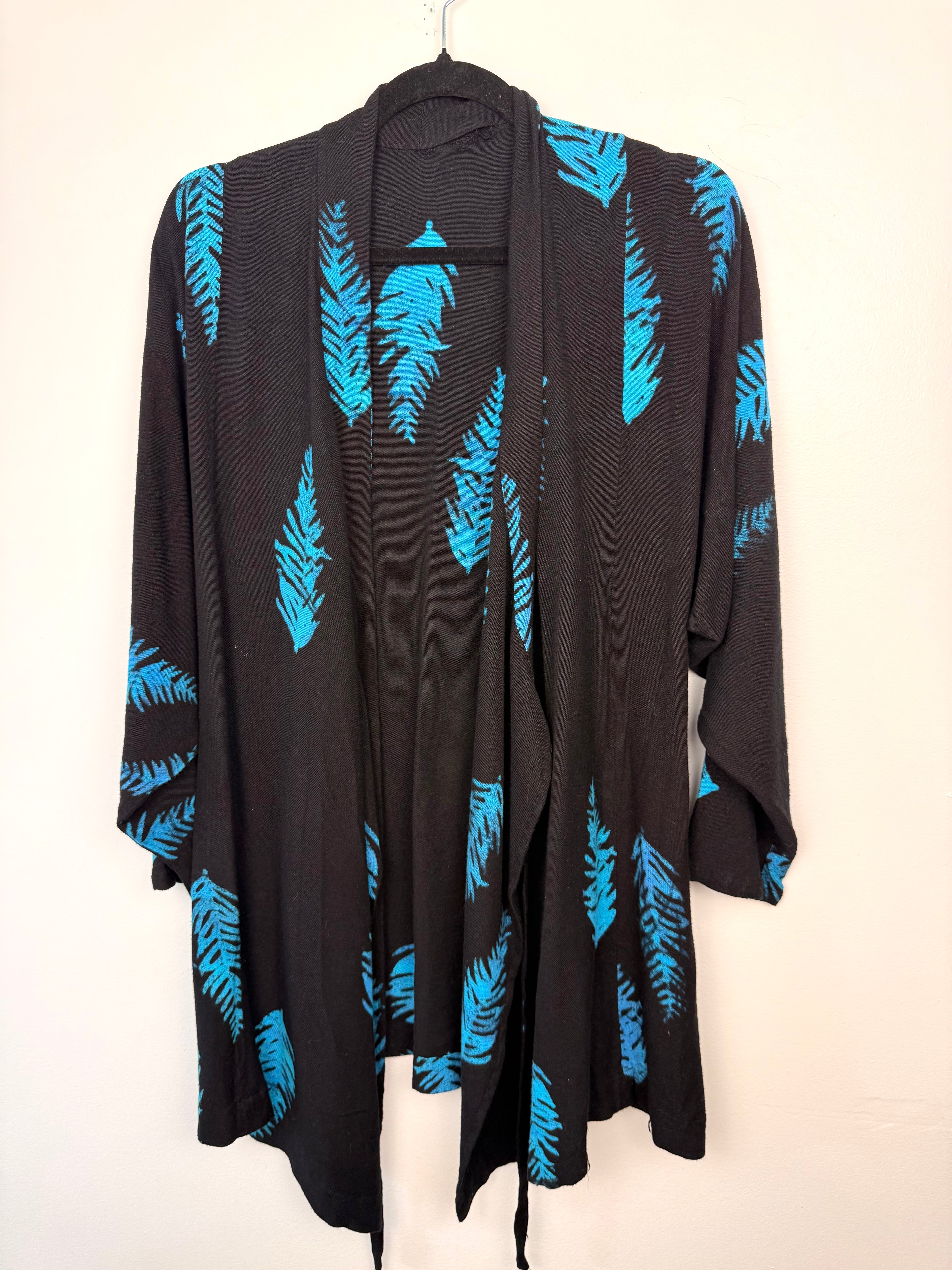Black & Turquoise Feather Print One-Size Wrap Kimono Jacket on hanger