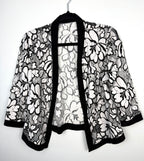 Black and white floral lace open front cardigan, lightweight sheer lace jacket with cropped silhouette and 3/4 sleeves on hanger