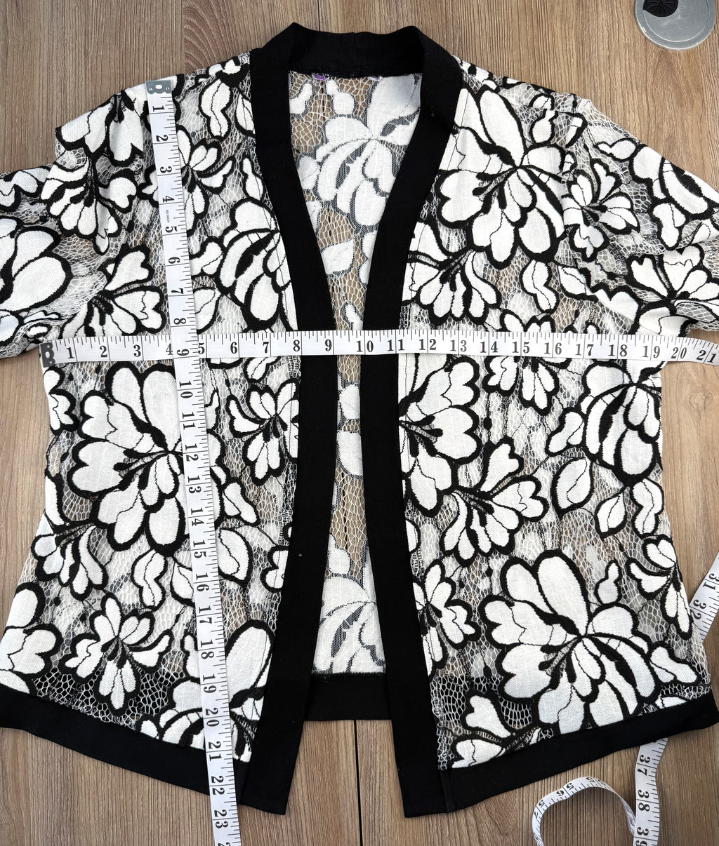 Black and white floral lace open front cardigan, lightweight sheer lace jacket with cropped silhouette and 3/4 sleeves measuring 40" bust and 23" shoulder to hem 