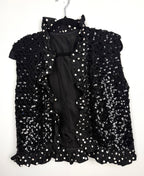 Black sequin vest with polka dot ruffle trim front view