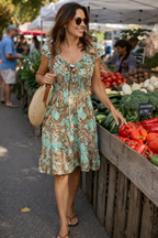 Boho_festival_dress_in_green_and_brown_at_Blue_Sparrow_Shop on woman at market