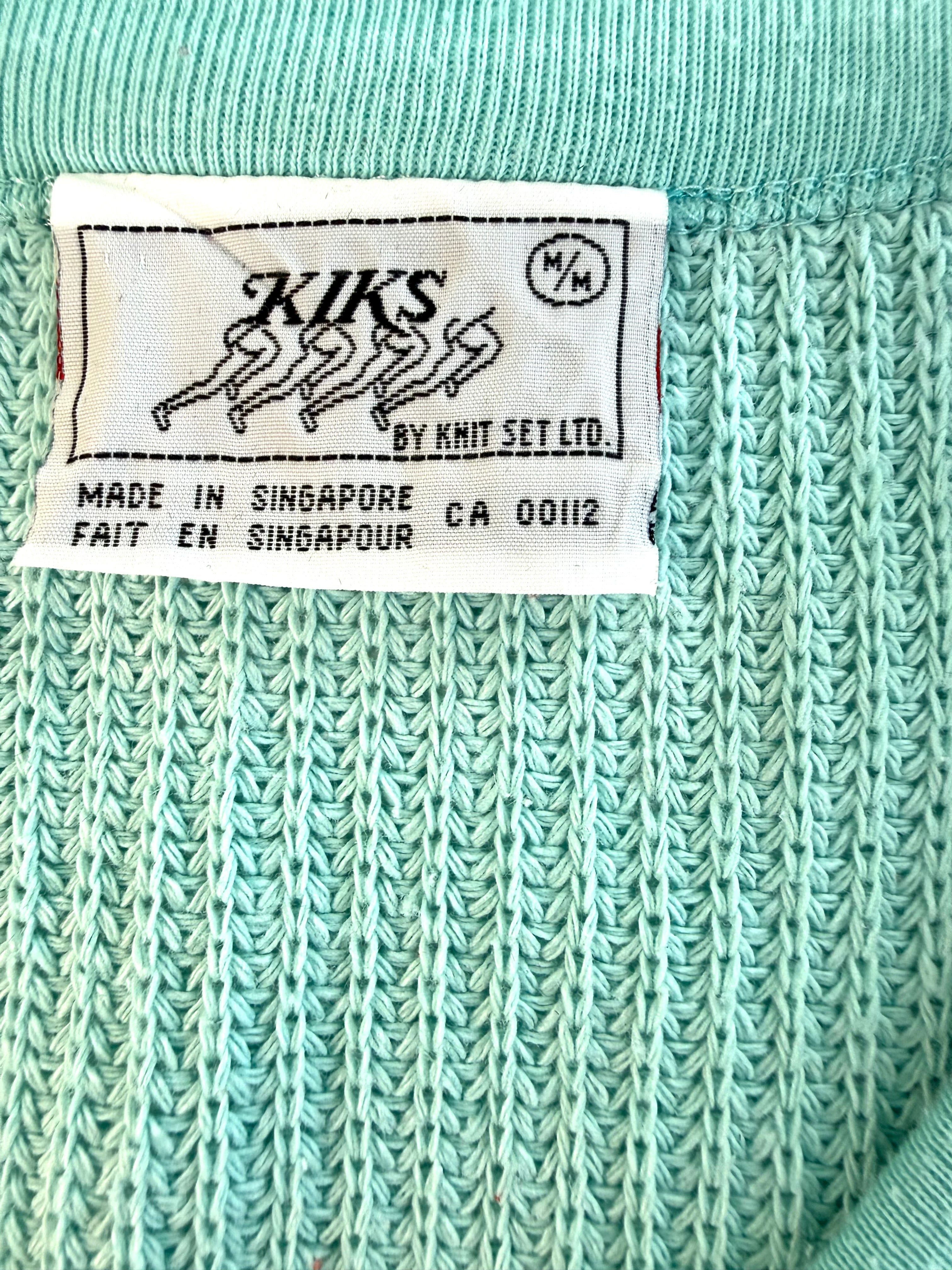 Brand label showing KIKS by Knit Set Ltd made in Singapore
