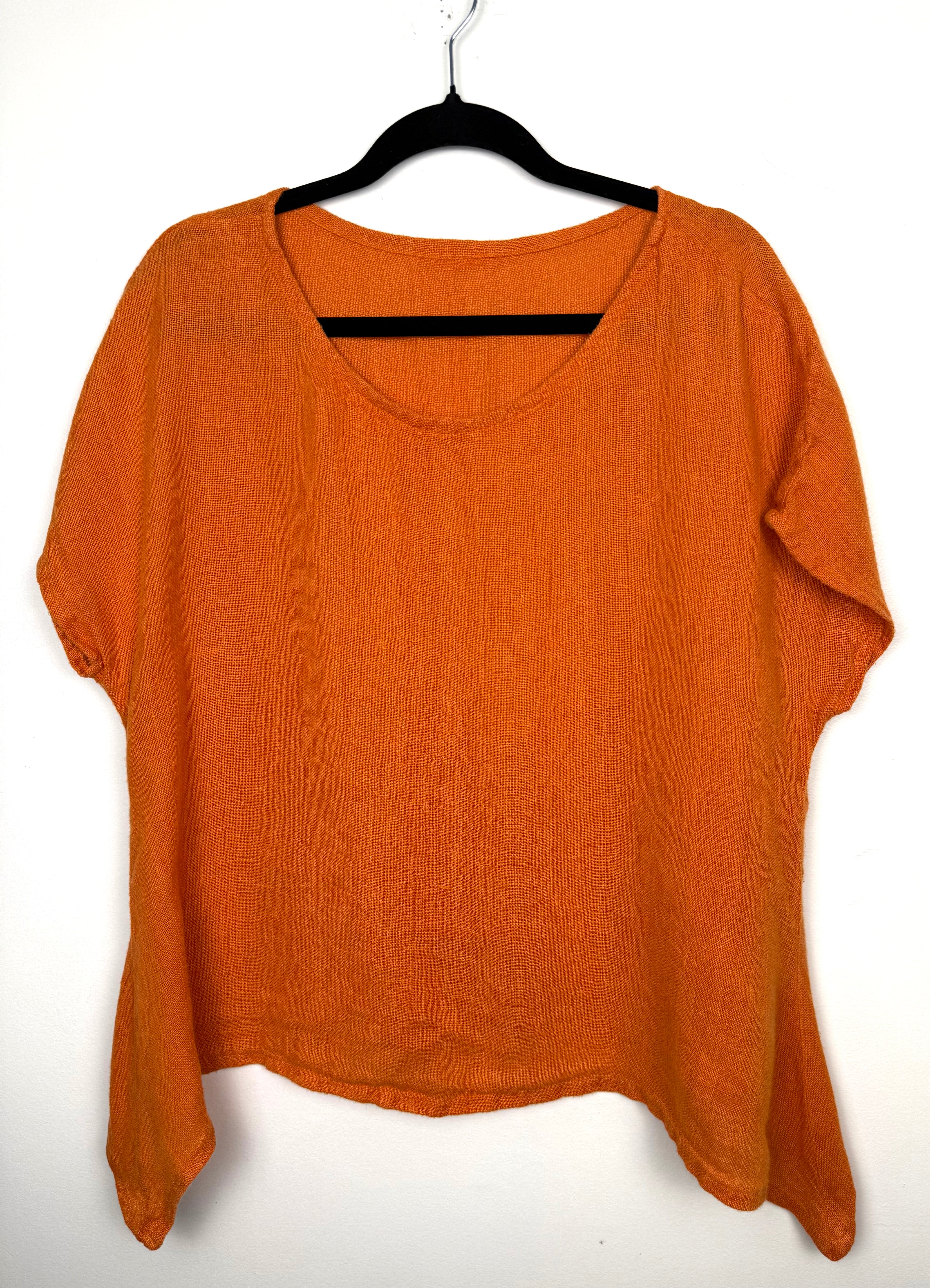 Burnt orange cotton short sleeved oversized top at Blue Sparrow Shop  on hanger
