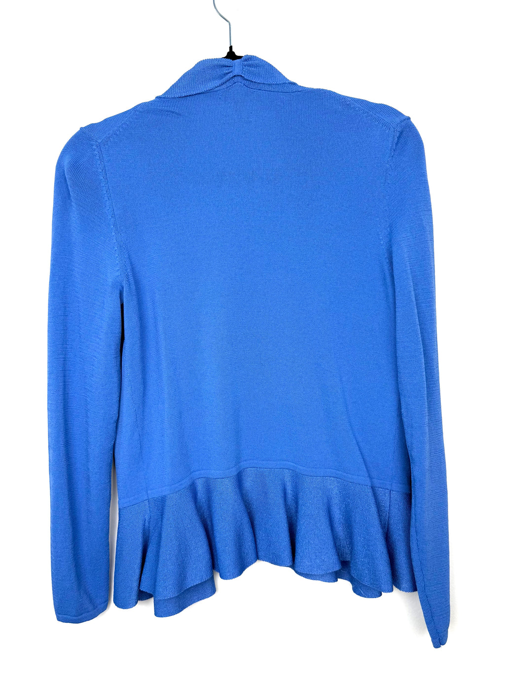 back view of Capsule wardrobe essential peplum waist cardigan in cornflower blue for a pop of colour in 2026