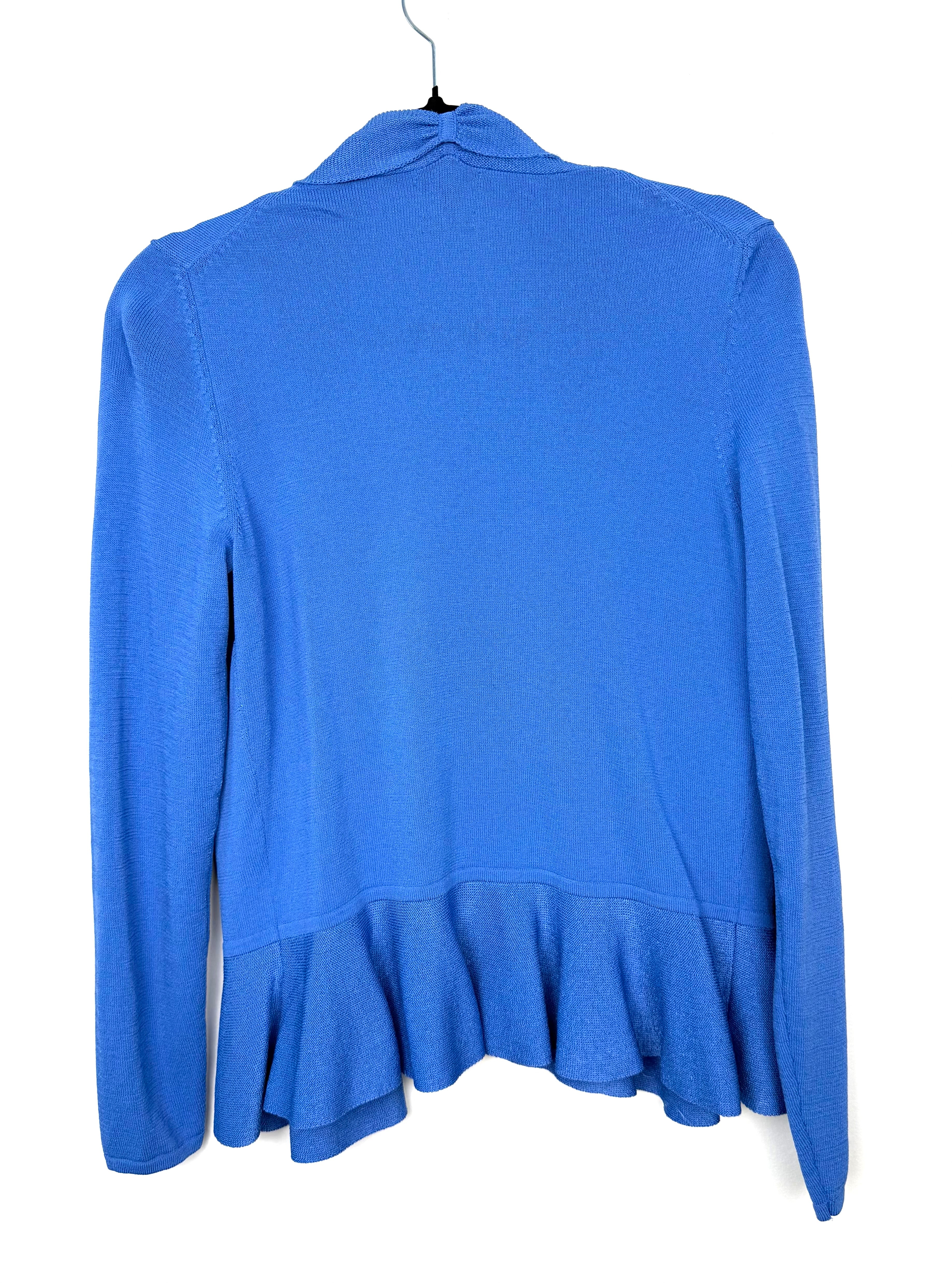 back view of Capsule wardrobe essential peplum waist cardigan in cornflower blue for a pop of colour in 2026