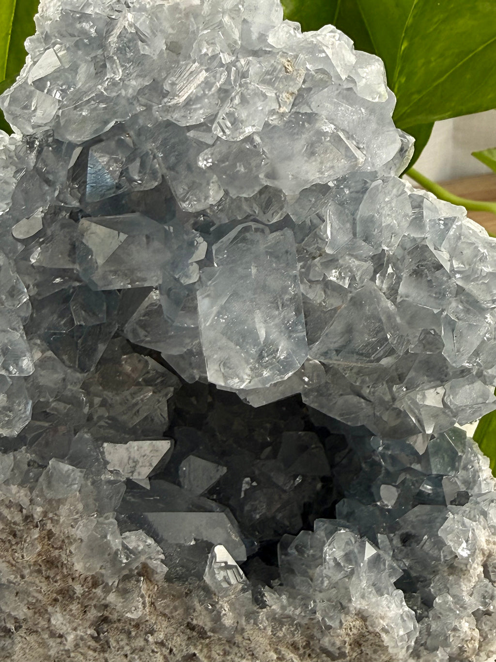 Close-up of a crystal formation with a dark center and light-colored exterior.