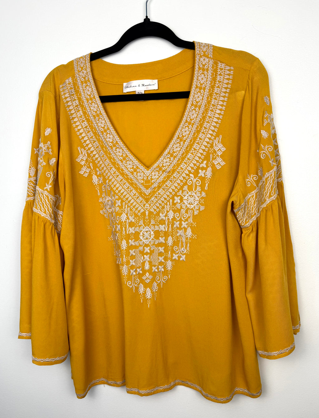 Chelsea & Theodore Embroidered Boho Blouse in mustard yellow on hanger 