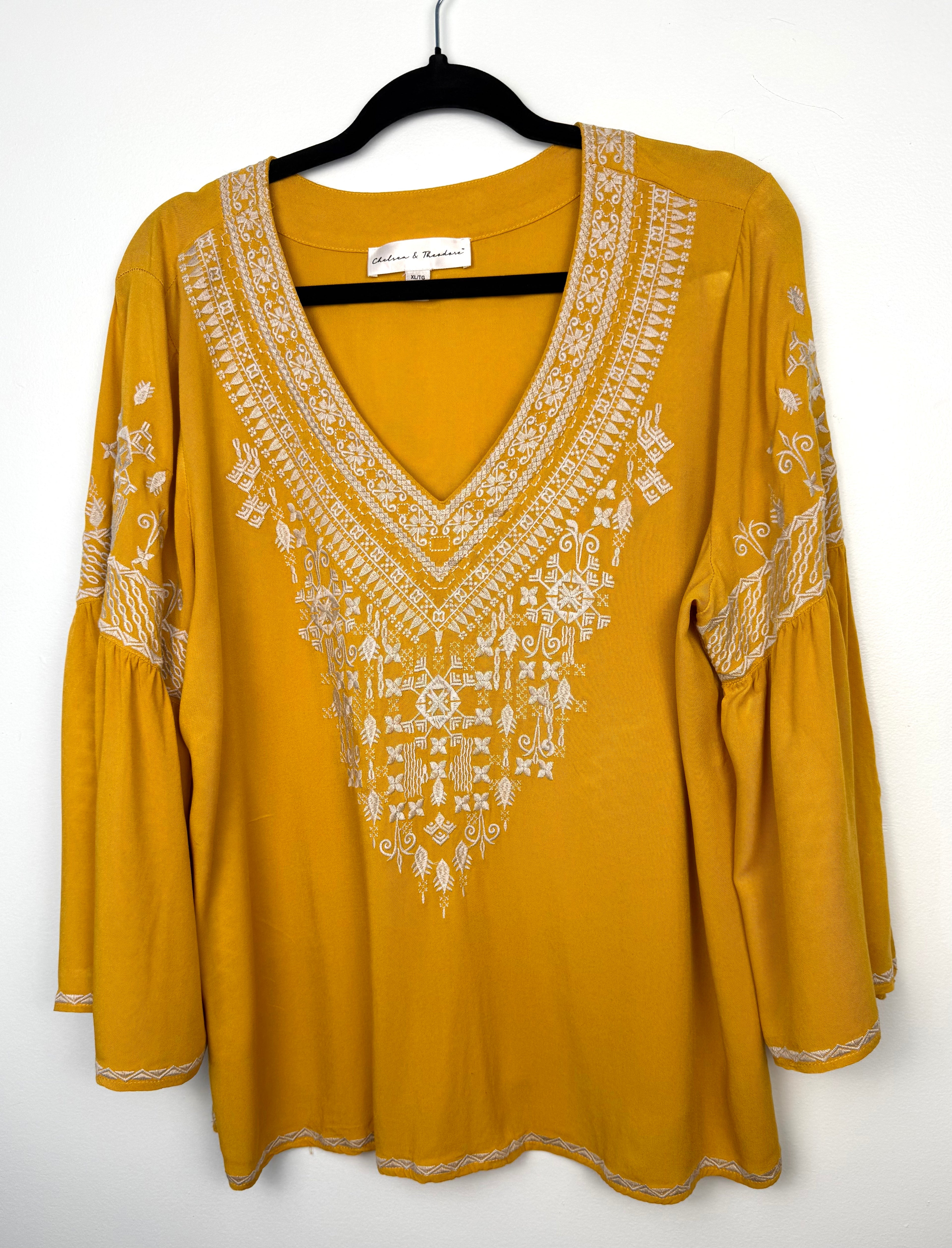 Chelsea & Theodore Embroidered Boho Blouse in mustard yellow on hanger 