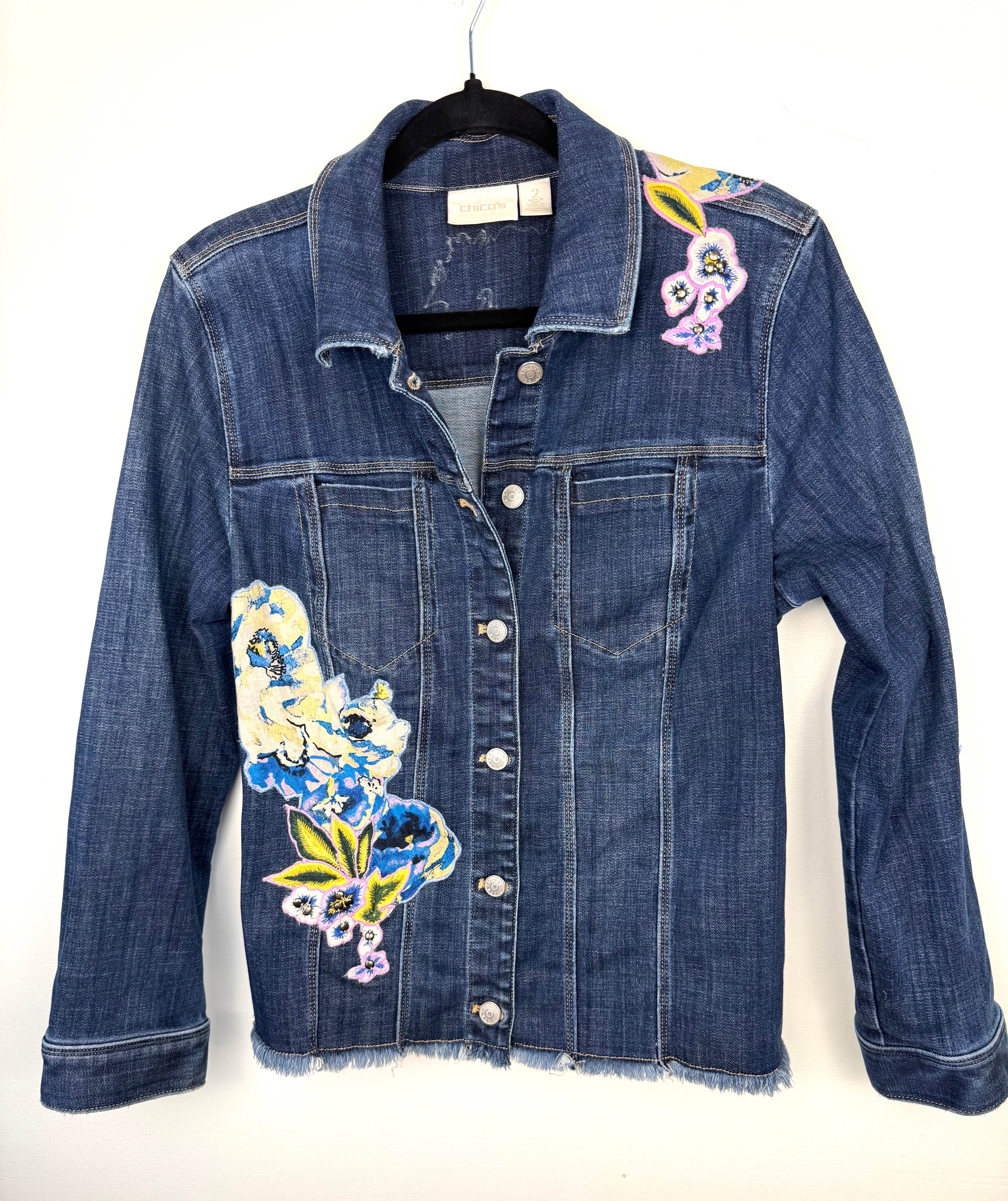 Chicos embroidered denim jacket on hanger