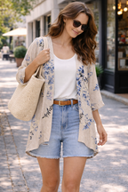 Cleo Floral Kimono Cardigan at Blue Sparrow Shop on woman outdoors with shorts on 